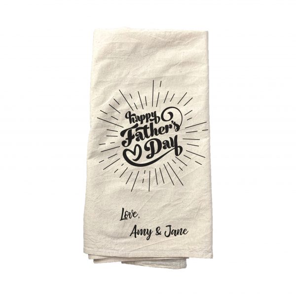 A natural tea towel that has "happy fathers day" custom printed on it